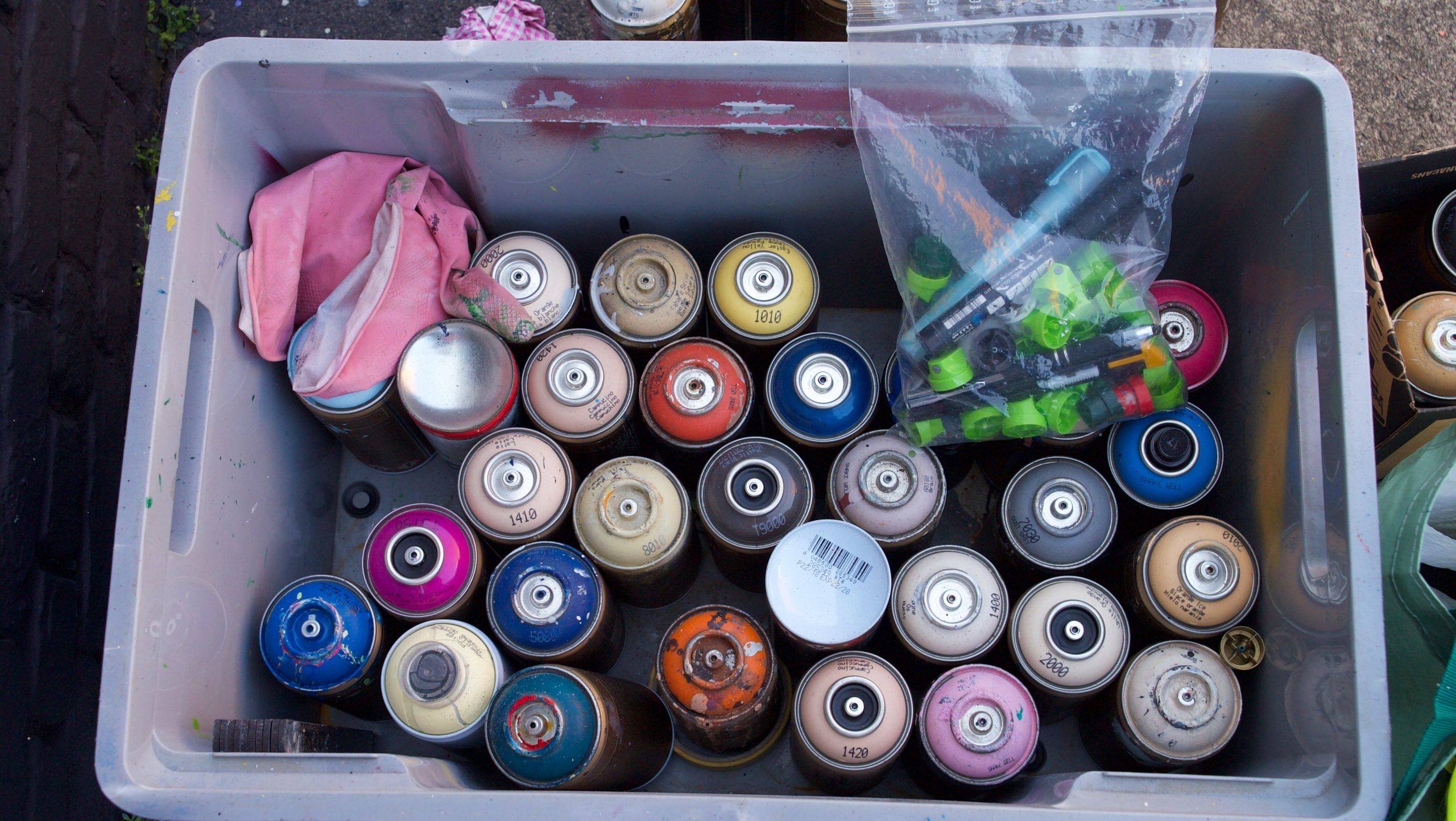 crate with cans of paint